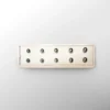 A white rectangular object with holes in it.